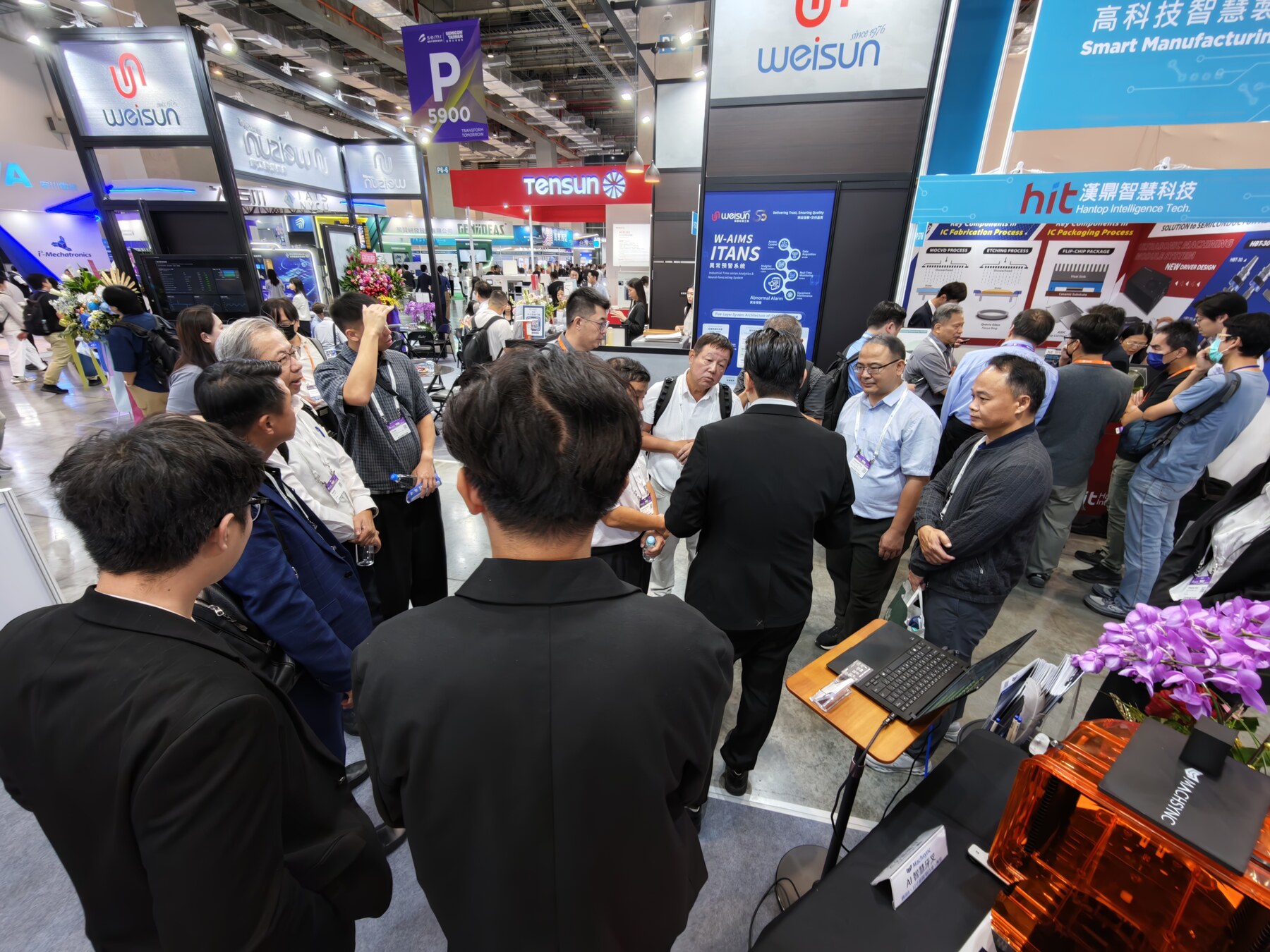 Visitors discussing the equipment on display